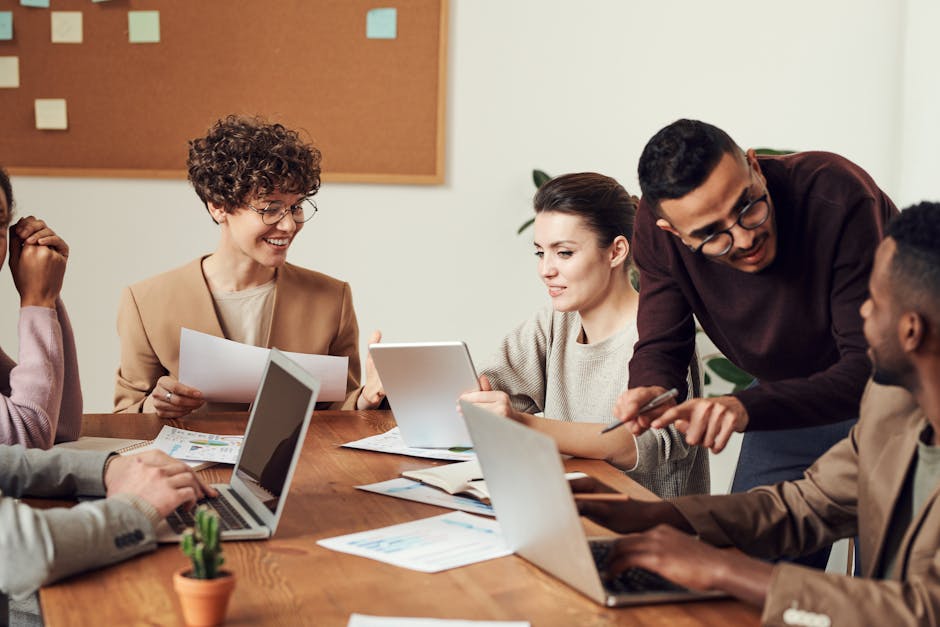A diverse group of professionals engaged in a collaborative office meeting